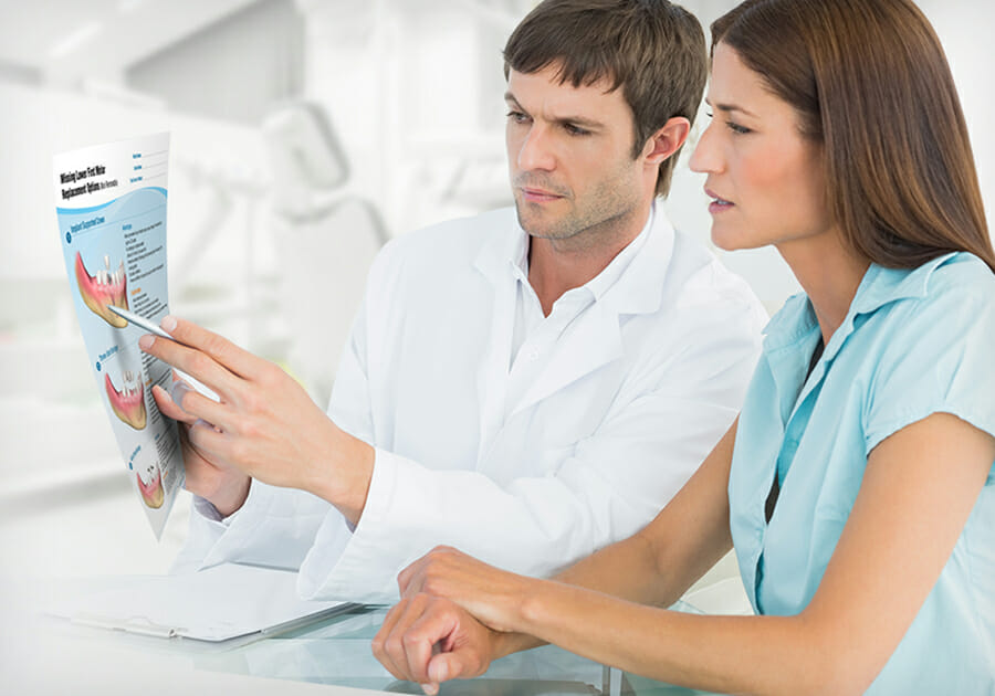 Dentist showing patient dental patient education software